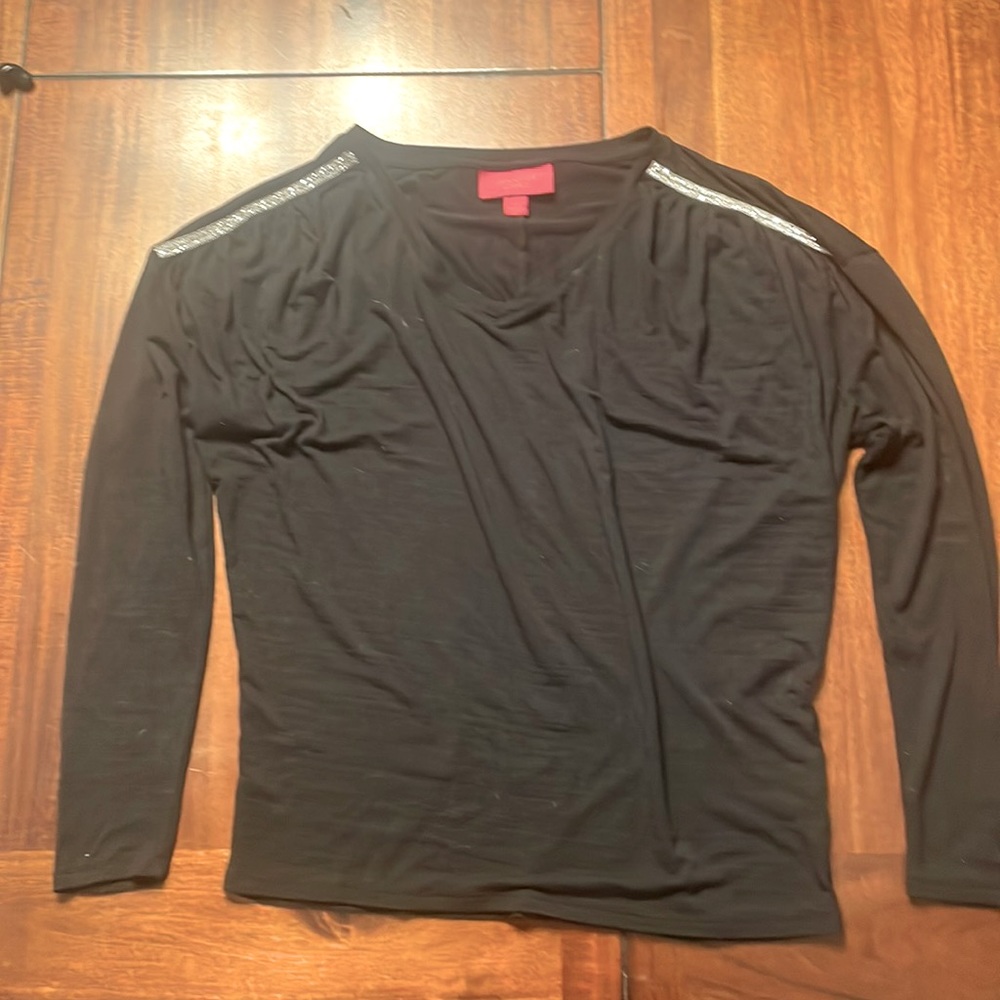 Never worn Jennifer Lopez blouse, has rhinestones on the shoulders.
